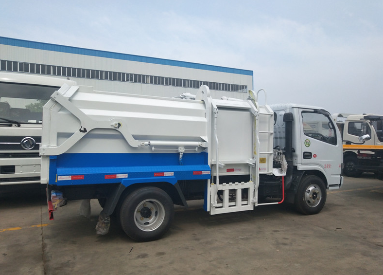 東風(fēng)5方側(cè)裝壓縮式對(duì)接垃圾車-5方側(cè)裝壓縮式對(duì)接垃圾車